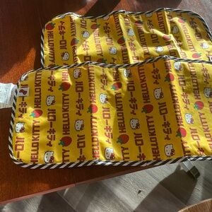 (2) Hello kitty yellow diaper pad ju-ju-be